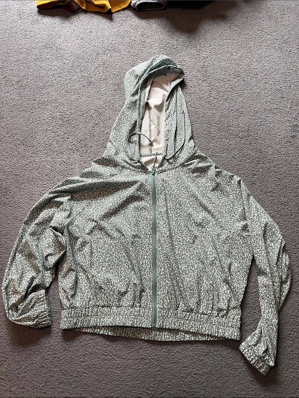 Light Green Speckled Hooded Zip Jacket.